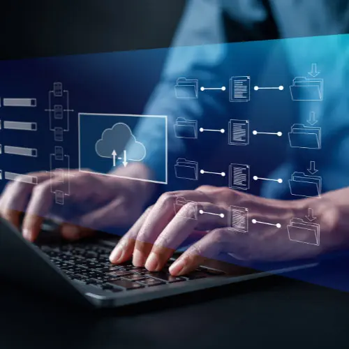 Hands typing on a laptop with digital cloud storage and file management icons overlaid, representing agency management system software