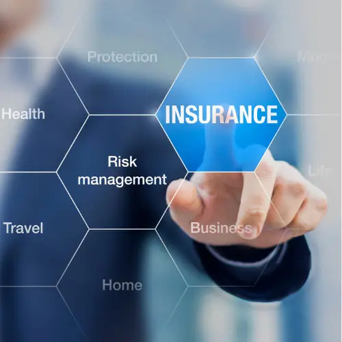 Businessman touching a digital 'Insurance' hexagon icon surrounded by related terms like protection, risk management, and health, representing current insurance issues