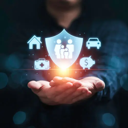 Hands cupped beneath a glowing shield icon with family, home, car, and financial protection symbols, representing insurance marketing issues